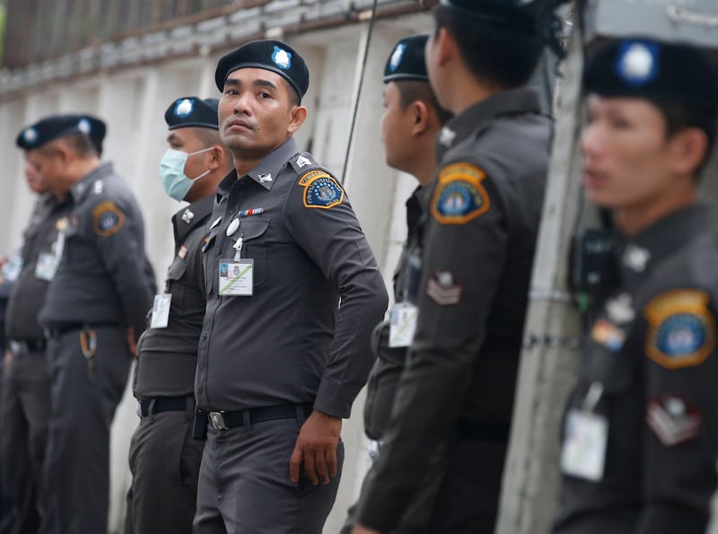epa06095726 Thai police officers stand guard at the criminal court in Bangkok, Thailand, 19 July 2017. Thai court on 19 July will announce a verdict in the case of more than a hundred suspects, who are allegedly involved in human trafficking, including a Thai senior Army Advisor Lieutenant General Manas Kongpan. More than 150 warrants have been issued against officials suspected of their involvement in the trafficking ring after investigators discovered mass graves of Rohingya migrants in southern Thailand in 2015.  EPA/NARONG SANGNAK