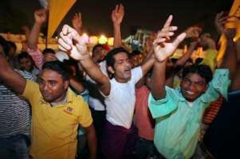 United Arab Emirates -Dubai- Aug. 13, 2009:



ARTS & LIFE: Construction company laborers working in the UAE sing-a-long and dance to songs in the audience of the Camp ka Champ Antakshari Contest (cq-al), a singing contest akin to "American Idol," at Al Nasr Leisureland in Dubai on Thursday, Aug. 13, 2009. Amy Leang/The National

 *** Local Caption ***  amy_081309_campkachamp_02.jpg