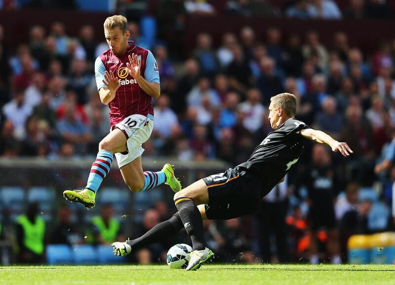 Andreas Weimann of Aston Villa closes down Michael Dawson of Hull City during their Premier League match on Sunday. Clive Mason / Getty Images