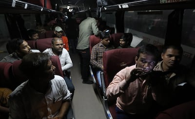 Indian citizens repatriated from Sudan board a bus after arriving at Indira Gandhi International Airport in New Delhi, India, on Wednesday. EPA
