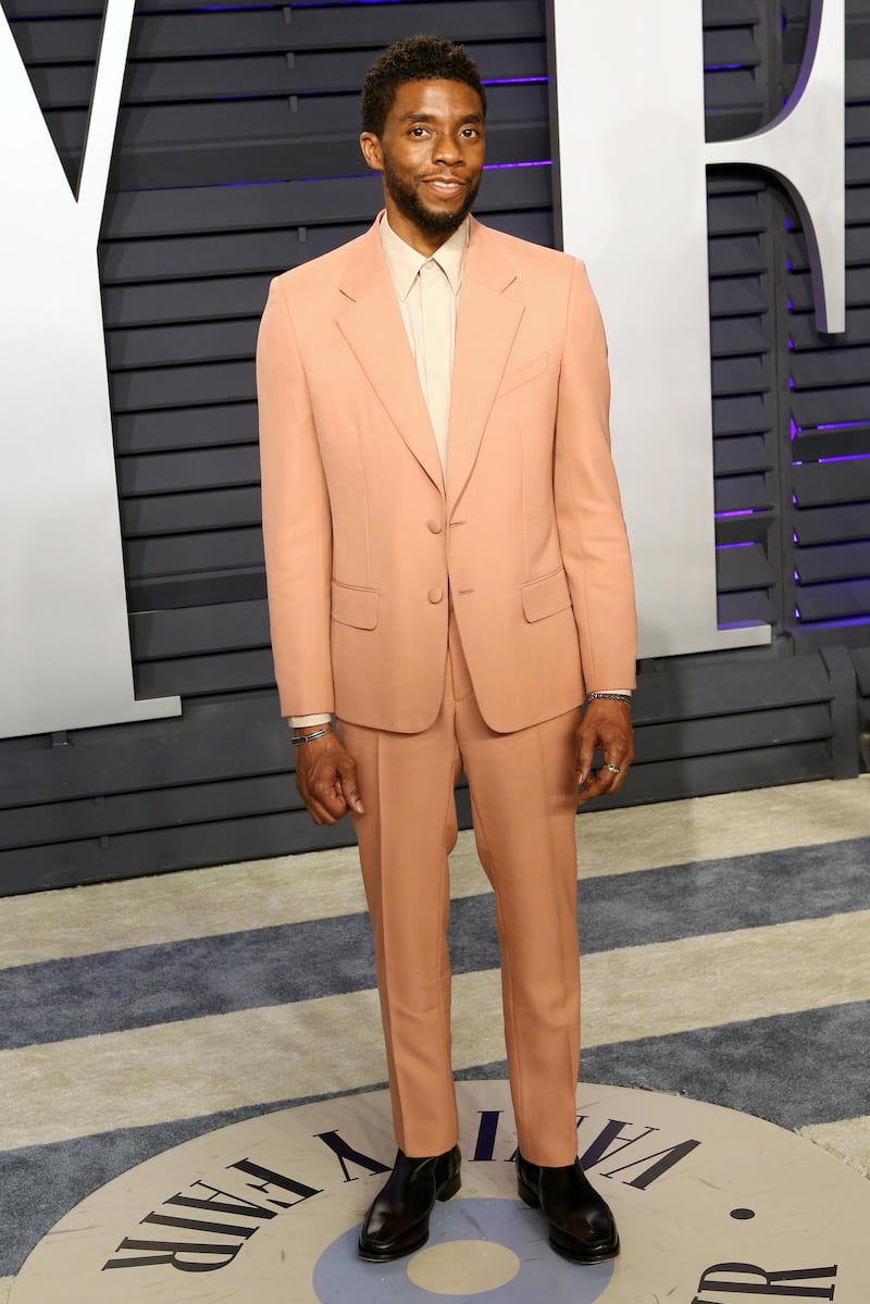 epa07396751 Chadwick Boseman poses at the 2019 Vanity Fair Oscar Party following the 91st annual Academy Awards ceremony, in Beverly Hills, California, USA, 24 February 2019. Peach suit by Clare Waight Keller for Givenchy. The Oscars are presented for outstanding individual or collective efforts in 24 categories in filmmaking.  EPA-EFE/NINA PROMMER