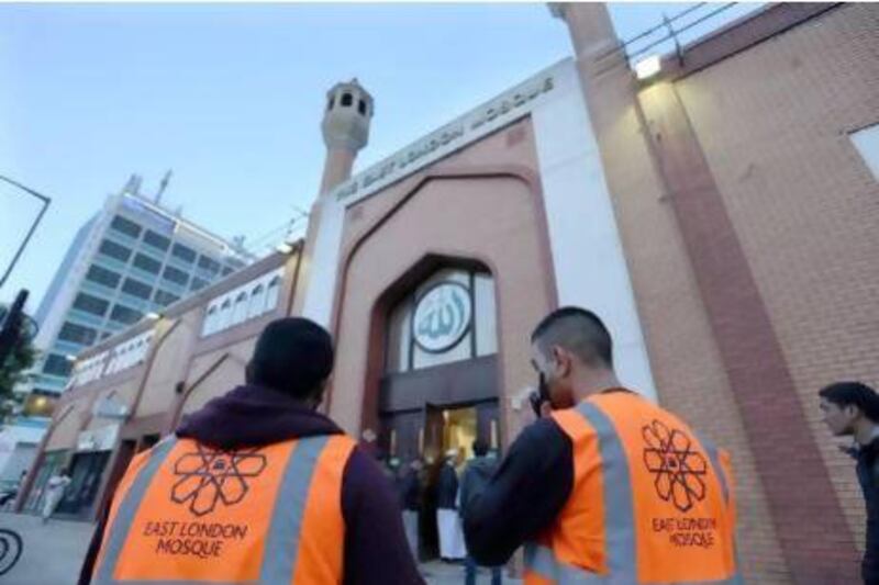 Volunteers patrol outside the East London Mosque in Whitechapel, London, as security was increased for potential targets of anti-Islam attacks. Stephen Lock for The National