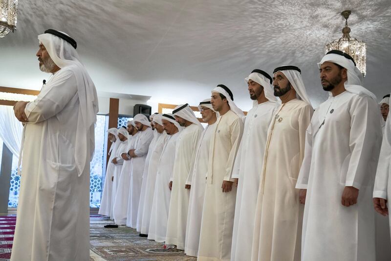 DUBAI, UNITED ARAB EMIRATES -June 09, 2018: HH Sheikh Hamdan bin Zayed Al Nahyan, Ruler’s Representative in Al Dhafra Region (R), HH Sheikh Mohamed bin Rashid Al Maktoum, Vice-President, Prime Minister of the UAE, Ruler of Dubai and Minister of Defence (2nd R), HH Sheikh Mohamed bin Zayed Al Nahyan, Crown Prince of Abu Dhabi and Deputy Supreme Commander of the UAE Armed Forces (3rd R) and HH Sheikh Mansour bin Zayed Al Nahyan, UAE Deputy Prime Minister and Minister of Presidential Affairs (4th R), pray during an iftar reception at Zabeel Palace.

( Mohamed Al Hammadi / Crown Prince Court - Abu Dhabi )
---