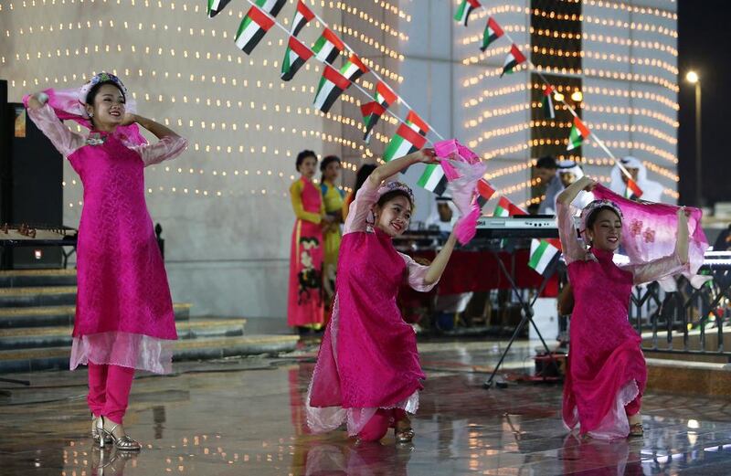 Artists from Vietnam perform during the UAE 45th National Day celebration held at Ministry of Culture and Knowledge Development Centre in Fujairah. Pawan Singh / The National