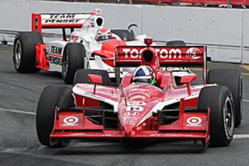 Dario Franchitti leads Ryan Briscoe's Penske  during Sunday's Indycar race in Toronto, which the Briton won for his third success of the season. He now leads the championship standings.