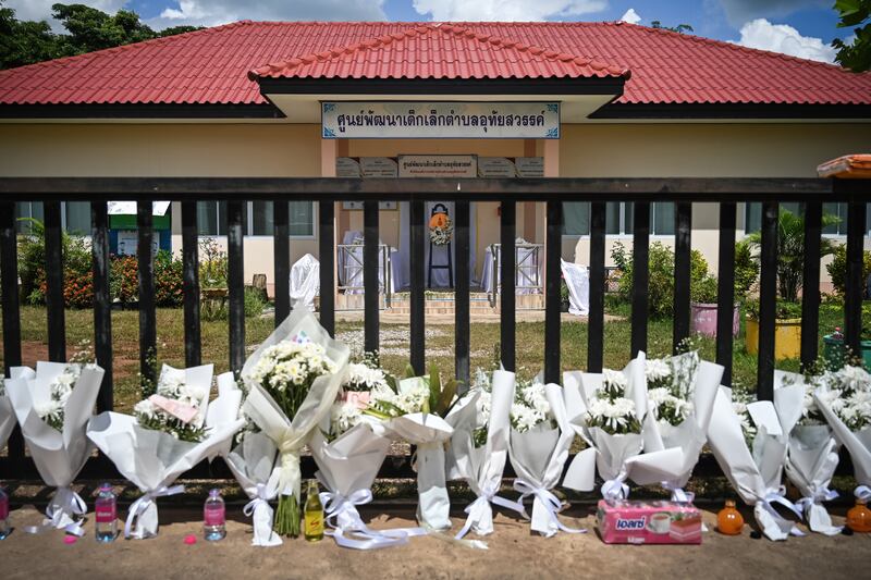 Toys, flowers and notes are left as offerings for the children who died in a mass shooting at a child care center in Uthai Sawan subdistrict, Nong Bua Lamphu, Thailand. Getty Images