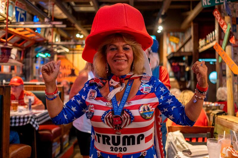 A woman poses for a photo during an election night watch party organized by a group called "Villagers for Trump" in The Villages, Florida.  AFP