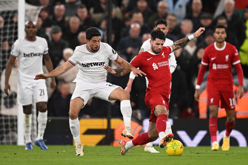 West Ham United's Pablo Fornals fights for the ball with Liverpool's Dominik Szoboszlai. AFP