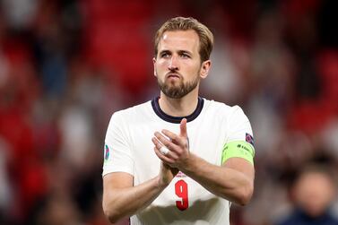 FILE - In this Sunday, July 11, 2021 file photo, England's Harry Kane applauds the fans during the Euro 2020 soccer championship final match between England and Italy at Wembley stadium in London.  Harry Kane may want out of Tottenham but new manager Nuno Espirito Santo sent a bold message Friday, July 16: “Harry's our player. ” The England captain has indicated he wants a change of scenery after Tottenham's seventh-place finish left it out of the Champions League this season but Nuno said he expects the striker to return.  (Carl Recine / Pool Photo via AP, file)