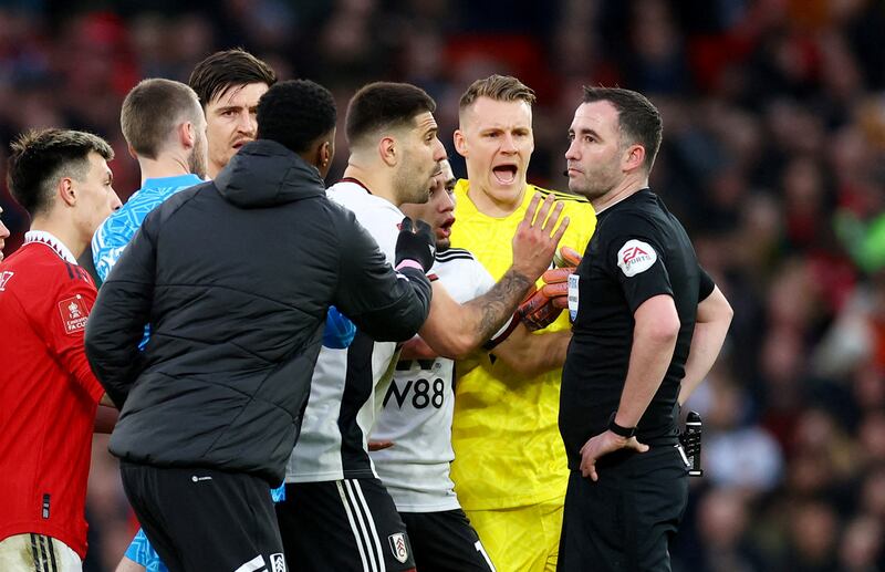 Fulham's Aleksandar Mitrovic and teammates react after he is shown a red card by referee Chris Kavanagh during the FA Cup tie against Manchester United. Reuters