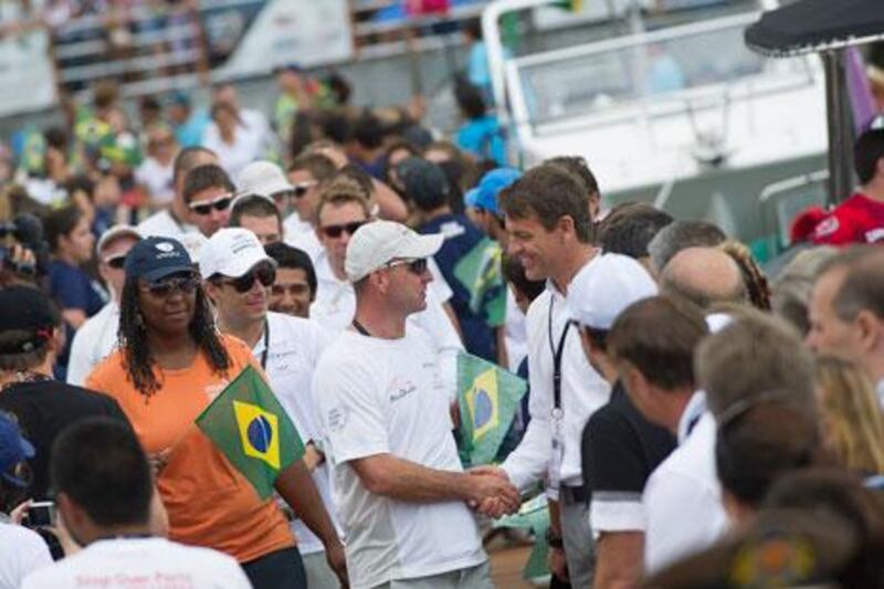 Ian Walker, the Azzam skipper, centre, takes a moment to shake hands with Knut Frostad, the Volvo Ocean Race chief executive officer, before the start of Leg 6 at Itajai, Brazil.