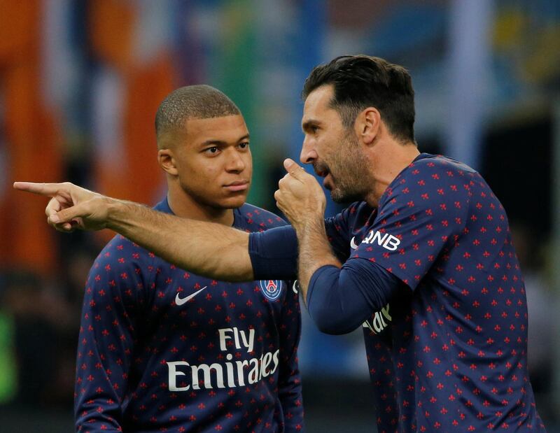 Soccer Football - Ligue 1 - Olympique de Marseille v Paris St Germain - Orange Velodrome, Marseille, France - October 28, 2018  Paris St Germain's Gianluigi Buffon and Kylian Mbappe before the match      REUTERS/Jean-Paul Pelissier