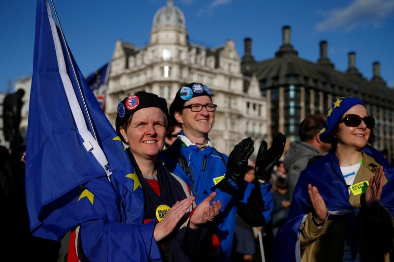 epa07934187 Demonstrators during the Peopleâ€™s Vote Together for the Final Say March, in London, Britain, 19 October 2019. Hundreds of thousands of people are taking part in the protest march calling for a referendum on the final Brexit deal on 'Super Saturday', as members of parliament sit in the House of Commons in London to debate and vote on Prime Minister Boris Johnson's final Brexit deal. The MP's voted to delay the approval of a Brexit deal.  EPA/HOLLIE ADAMS