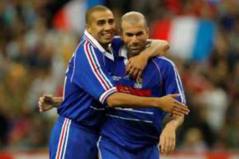 France's Zinedine Zidane (R) celebrates with David Trezeguet after scoring a goal during an exhibition soccer match between France's 1998 World Cup Champions and a selection of players from the rest of the world, to celebrate the 10th anniversary of France's World Champion title at the Stade de France in Saint-Denis near Paris July 12, 2008. REUTERS/Benoit Tessier (FRANCE) *** Local Caption ***  BTE10_FRANCE-SPORT-_0712_11.JPG