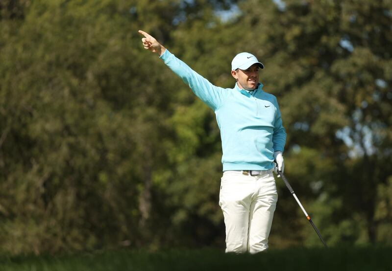 Rory McIlroy reacts to his shot from the eighth tee. AFP