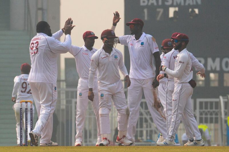 West Indies' Rahkeem Cornwall, left, celebrates the dismissal of Afghanistan's Ibrahim Zadran at the Ekana Cricket Stadium in Lucknow. AFP