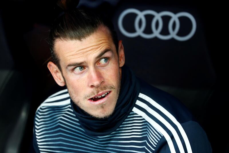 Real Madrid's Gareth Bale looks on from the bench before the match against Real Betis. Real Madrid lost the match 2-0 with Bale remaining on the bench throughout. Reuters