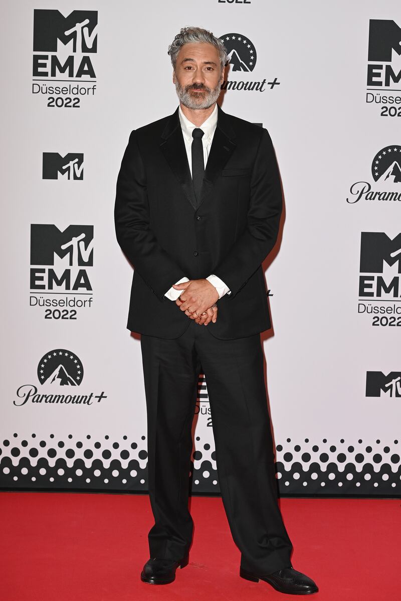 Taika Waititi wears a black suit. Getty Images 