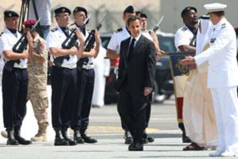 Nicolas Sarkozy, the French President and Sheikh Saif the Interior Minister inspect French military personel at the opening of the French Naval Base in Abu Dhabi.