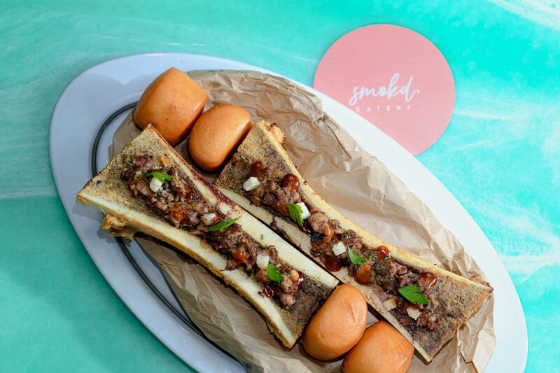 The oven-baked bone marrow and burnt ends brisket tartars with mantou buns is a standout dish. Photo: Smokd Eatery