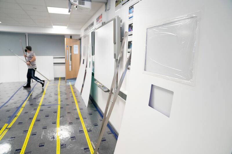 A Covid testing area is constructed at Great Academy Ashton in Ashton-Under-Lyne. AP Photo