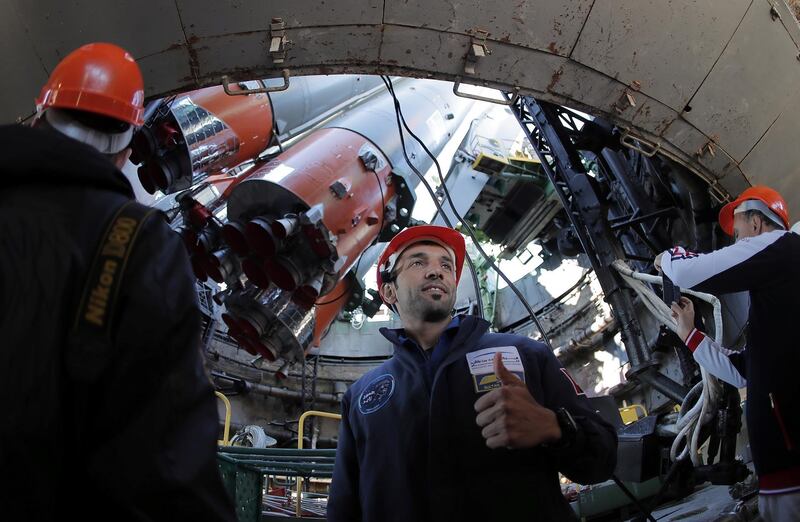 Backup crew member UAE astronaut Sultan Al Neyadi smiles as the Soyuz booster rocket FG with Soyuz MS-15 spacecraft is installed on the launchpad at the Baikonur Cosmodrome, Kazakhstan, September 23, 2019. Maxim Shipenkov/Pool via REUTERS