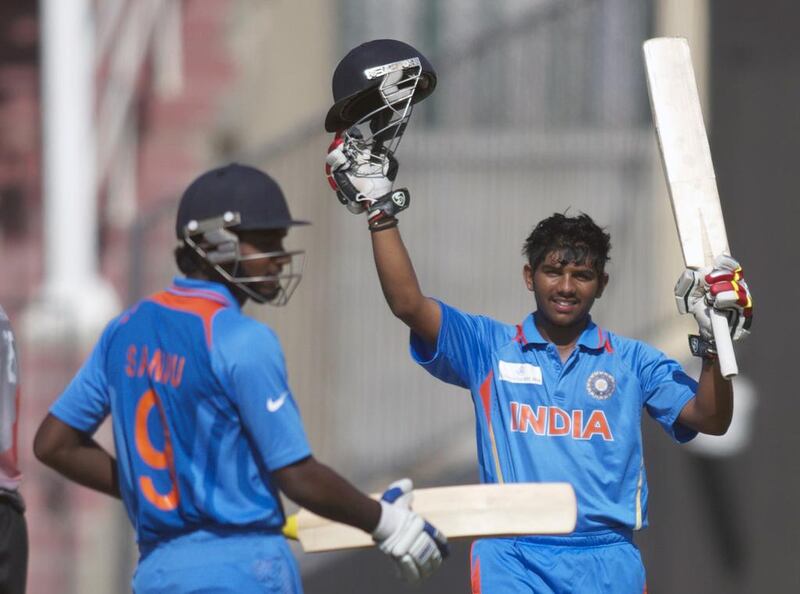 India's Akhil Herwadkar, right, top-scored with a fine hundred against the UAE at the Sharjah Cricket Stadium on Saturday. Kevin J Larkin for The National