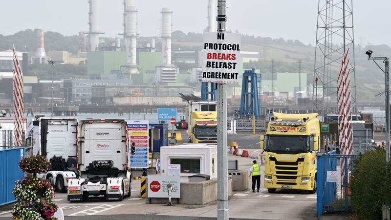 Posters by people who oppose a border in the Irish Sea are displayed as freight is checked at Larne harbour, one of the main entry points between Northern Ireland and the rest of the United Kingdom. Photo: Getty