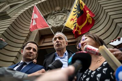 Tariq Ramadan leaves the courthouse in Geneva with his lawyers. AFP