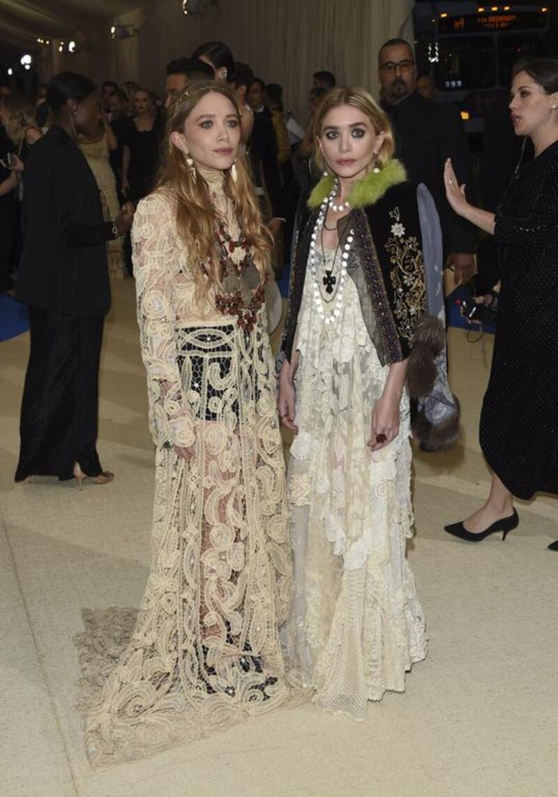 Stylish siblings Mary-Kate and Ashley Olsen sport their fashion label, The Row, albeit with a host of bohemian accessories. Evan Agostini / Invision / AP