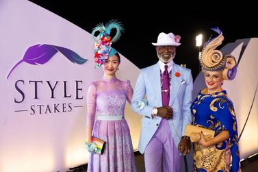 Style Stakes Best Dressed Couple winners Nader Tearab and Zheng-Gi-Ya, with Best Hat winner, Conna Tution at the Dubai World Cup on March 30, 2019. Twitter / Meydan   