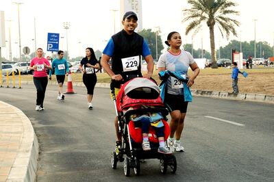 Zayed Sports City run for the fitness briefs - 5K and 10K runs. 
CREDIT: Zayed Sports City *** Local Caption ***  ADCB 5&10k run stroller.JPG
