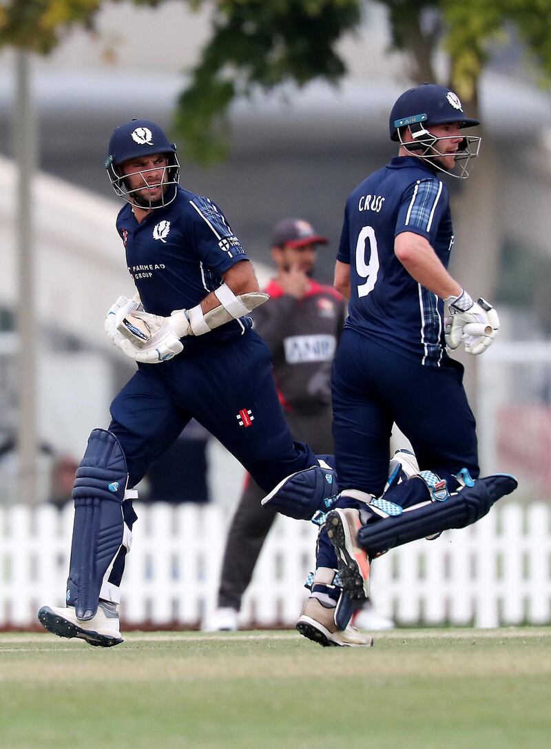 DUBAI, UNITED ARAB EMIRATES , Dec 15– 2019 :- Left to Right - Kyle Coetzer and Matthew Cross of Scotland running between the wickets during the World Cup League 2 cricket match between UAE vs Scotland held at ICC academy in Dubai. ( Pawan Singh / The National )  For Sports. Story by Paul
