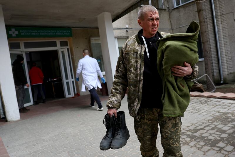 A soldier waits at a hospital after the attack on the Yavoriv military base. Reuters