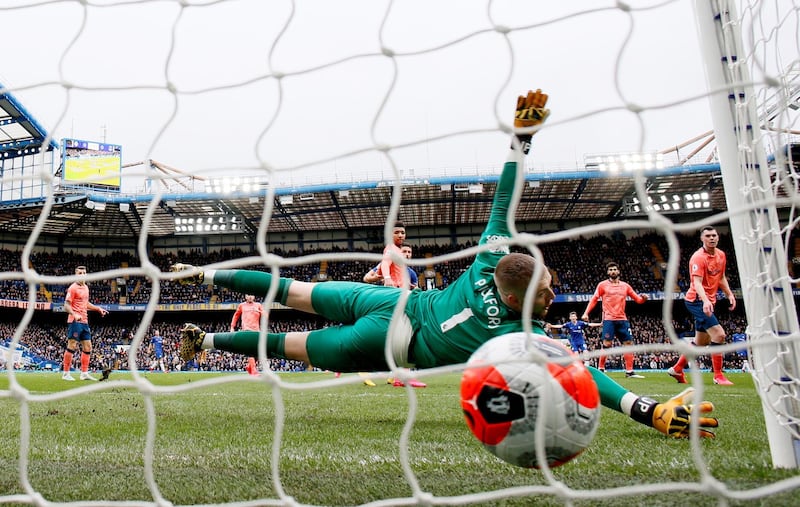 Everton goalkeeper Jordan Pickford is beaten by Mason Mount's shot that put Chelsea 1-0 up. Reuters