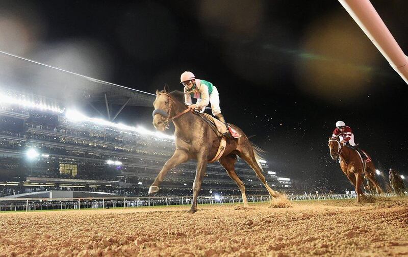 Mike Smith riding Arrogate wins the Dubai World Cup main event at the Meydan Racecourse on March 25, 2017 in Dubai. Martin Dokoupil / Getty Images