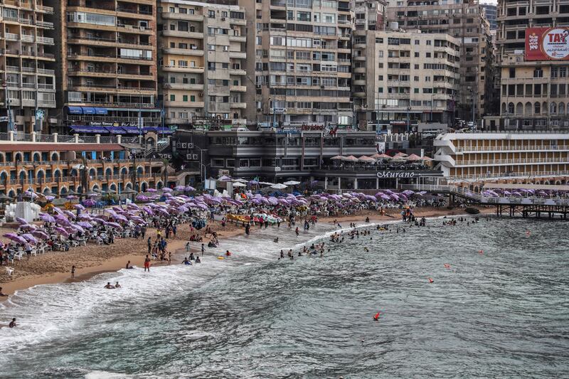 Egyptians on vacation at a popular beach in the city of Alexandria, on August 1, 2019.