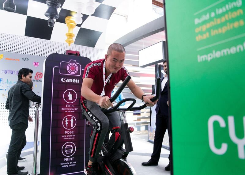 DUBAI, UNITED ARAB EMIRATES. 06 OCTOBER 2019. 
A man cycles to generate power at Dubai Internet City booth at Gitex Technology Week at Dubai World Trade Center.

(Photo: Reem Mohammed/The National)

Reporter:
Section: