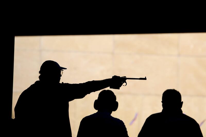 LONDON, ENGLAND - AUGUST 05:  Shooters compete in the Men's 50m Pistol Shooting on Day 9 of the London 2012 Olympic Game at the Royal Artillery Barracks on August 5, 2012 in London, England.  (Photo by Lars Baron/Getty Images)