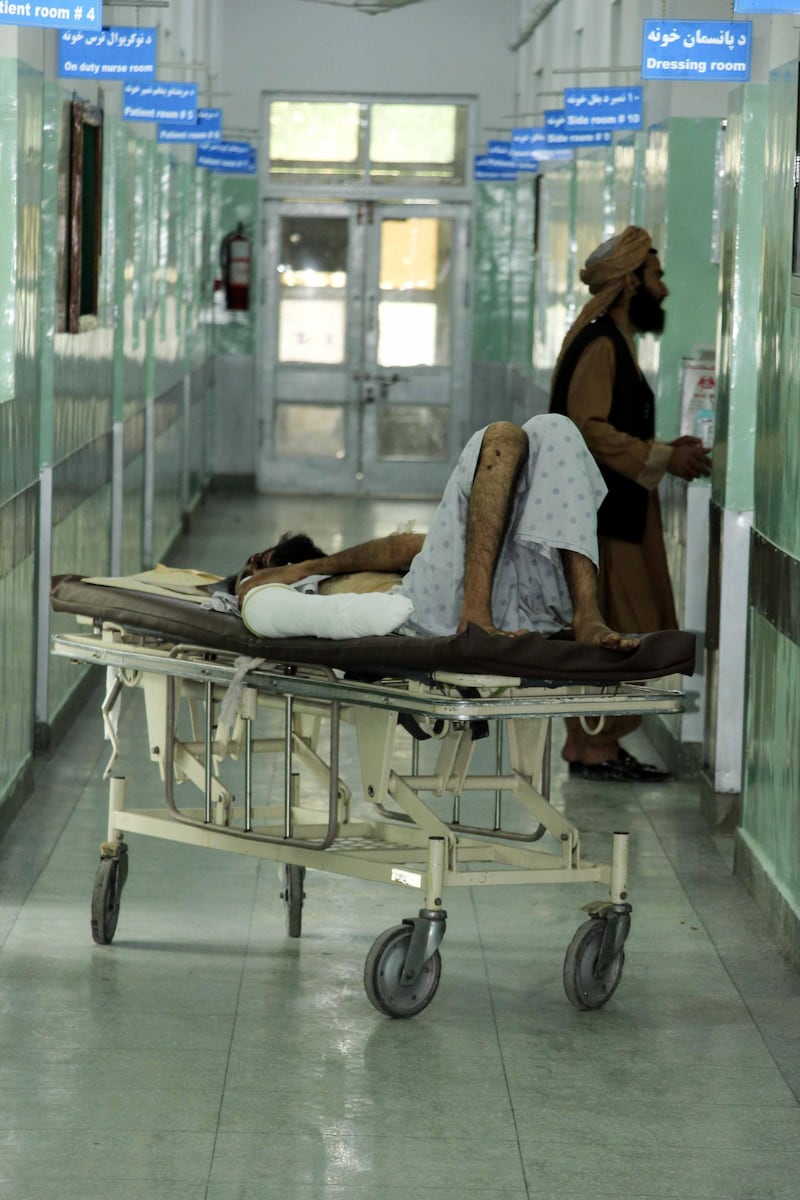 An Afghan man who was injured in a bomb blast, receives medical treatment at a hospital in Arghandab district of Kandahar, Afghanistan, April 15. EPA