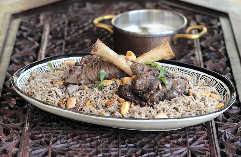 Dubai, United Arab Emirates - May 09, 2019: Iftar Signature Dish. Lamb Ouzi from Khaymat Al Bahar at Jumeirah Al Qasr. Thursday the 9th of May 2019. Dubai. Chris Whiteoak / The National

Chefs description:ÊA staple main course in Ramadan, this authentic Middle Eastern dish is popular across the GCC and found at most Iftar spreads and often cooked at home. The dish is painstakingly created over 3 Ð 4 hours and consists of an entire lamb cooked and served with oriental rice. Due to the size of the dish and the preparation time, thisÊdish served as a sharing main course at Iftar.