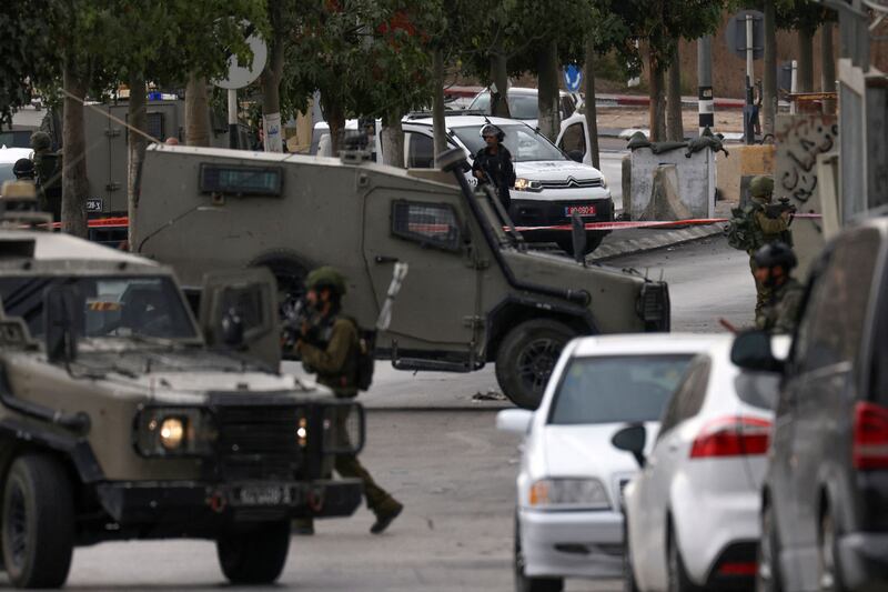 Israeli soldiers cordon off an area after a shooting in Hebron in the occupied West Bank. AFP
