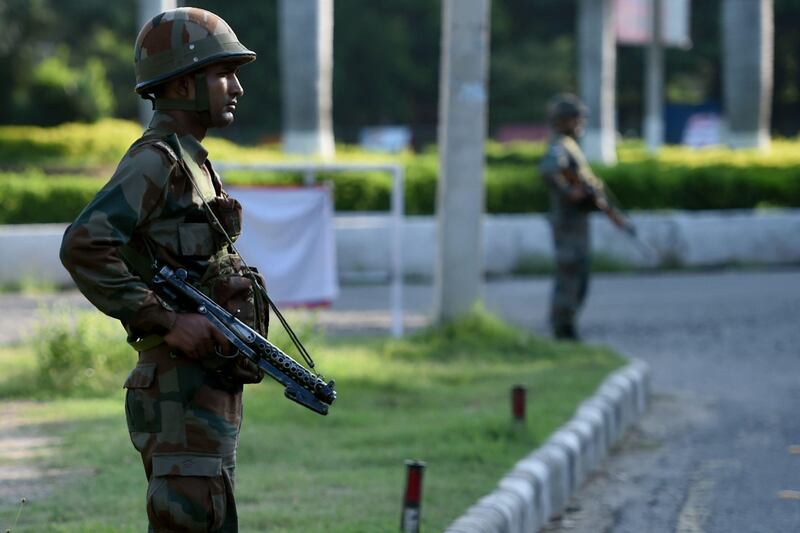 Indian soldiers stand guard at Panchkula on August 26, 2017, after followers of controversial guru Ram Rahim Singh on August 25 went on a rampage after their spiritual leader was convicted of rape.   
At least 32 people were killed August 25 when clashes broke out in northern India after a court convicted a controversial religious leader of raping two of his followers, sparking fury among tens of thousands of supporters who had gathered for the verdict. / AFP PHOTO / Money SHARMA