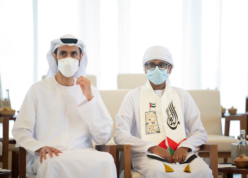 Khamis and Ahmed Al Muhairi, one of the world's foremost theoretical physicists, attend a Sea Palace barza. Photo: Ministry of Presidential Affairs 
