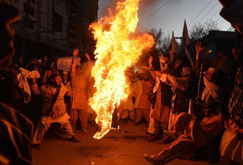 Pakistani demonstrators burn the US flag at a protest in Quetta. Banaras Khan / AFP Photo