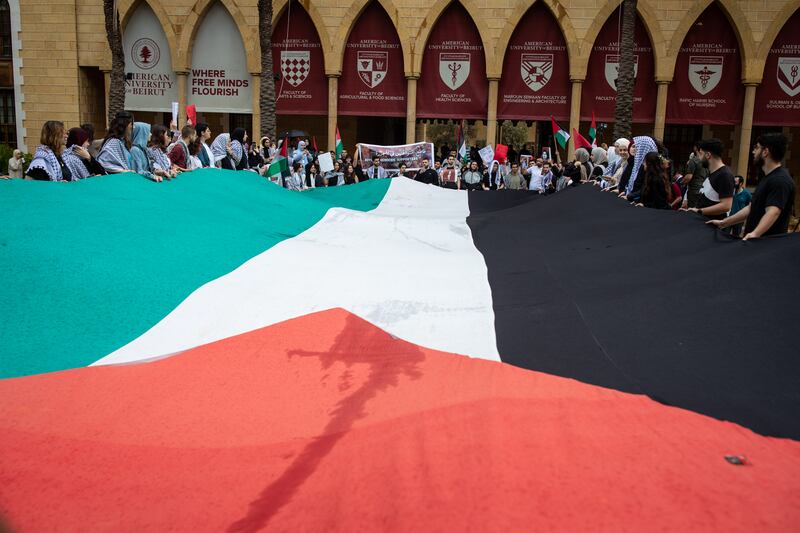 Students at the American University of Beirut unfurl a large Palestinian flag while they protest the war in Gaza on Tuesday 30th April in Beirut. All Photos: Oliver Marsden for The National  