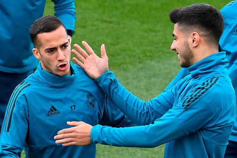 Real Madrid midfielders Marco Asensio, right, and Lucas Vazquez during a training session. Gabriel Bouys / AFP