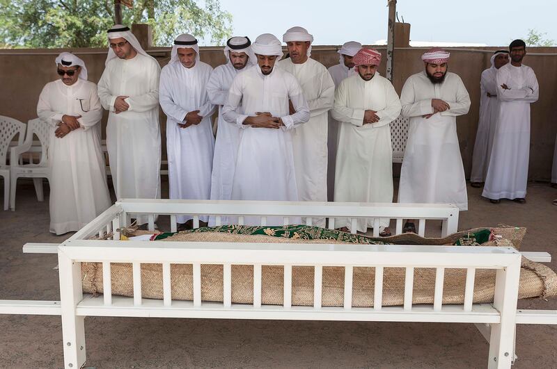 FUJEIRAH, UNITED ARAB EMIRATES, 19 JUNE 2017. The funeral of Emirati Athlete Abdullah Hayayei in Qidfa that died from an accident in London while training. Prayer by family and commmunity members at the cemetery in Qidfa. (Photo: Antonie Robertson/The National) Journalist: Ruba Haza. Section: National.
