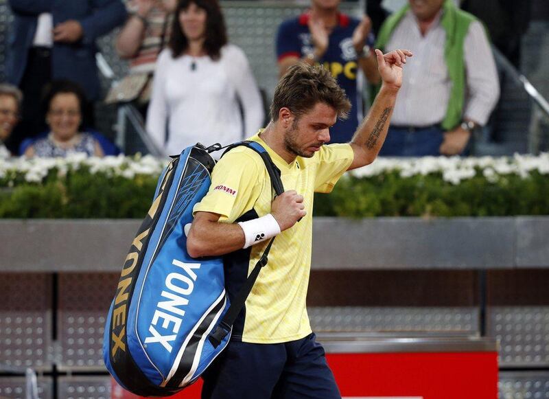 Stanislas Wawrinka of Switzerland walks away after his defeat against Dominic Thiem of Austria at the Madrid Masters on Tuesday. Susana Vera / Reuters / May 6, 2014 