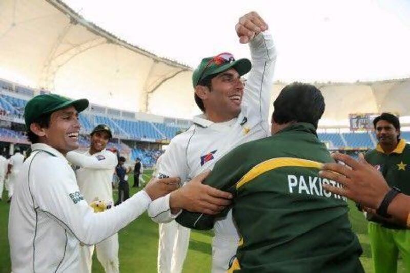 Pakistan captain Misbah-ul-Haq celebrates with coach Mohsin Khan.
